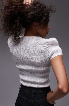 Head off to the weekend in textured finesse with this chic crop top made from breathable cotton. 20" length (size 8) Jewel neck Short sleeves 99% cotton, 1% elastane Machine wash, line dry Imported Chic Textured Summer Tops, White Fitted Slightly Cropped Tops, Chic Slightly Cropped Cotton Crop Top, Chic Fitted Textured Knit Blouse, Chic Textured Knit Fitted Blouse, Fitted Textured Knit Crop Top Crew Neck, Fitted Textured Knit Crew Neck Crop Top, Textured Knit Crew Neck Fitted Crop Top, Spring Cotton Top With Crinkle Texture