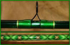 a close up of a green pen on a wooden table