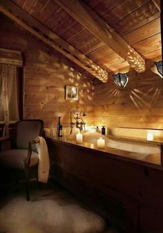 a rustic bathroom with candles on the counter