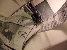 a close up of a newspaper laying on top of a sink