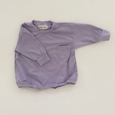 Harley Pocket Romper in Purple Cotton Long Sleeve Onesie For Loungewear, Cotton Long Sleeve Onesie For Fall, Cotton Long Sleeve Jumpsuits And Rompers For Playwear, Solid Cotton Jumpsuits And Rompers For Loungewear, Cotton Loungewear Jumpsuits And Rompers, Relaxed Fit Long Sleeve Cotton Onesie, Cotton Onesie For Spring, Long Sleeve Bodysuit For Playtime In Fall, Cotton Bodysuit For Playtime