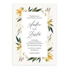 an elegant wedding card with white flowers and greenery