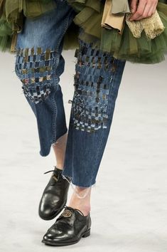 a woman's shoes and jeans on the runway at chanel spring / summer 2013