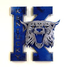 the letter k is decorated with an image of a tiger's head on it