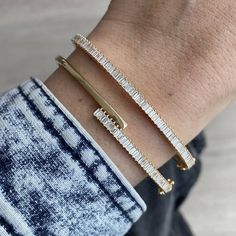 Baguette Diamond Bangle MATERIALSAvailable in 14k Yellow Gold, 14k Rose Gold and 14k White Gold DETAILSGold Weight: 8.40gCT Weight: 1.16 ct DimensionsWidth: 3mm *If in stock will ship in 2-3 business days. If back-ordered, please allow 4-7 weeks for delivery. Rush options may be available please contact hello@alevjewelry.com Luxury White Gold Bangle With Baguette Diamonds, Arm Candies, Bracelet Stacks, Diamond Bangle Bracelet, Necklace Length Guide, Stacked Wedding Rings, Bracelet Size Chart, Diamond Baguette, Diamond Bangles Bracelet