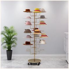 PRICES MAY VARY. ❧ HAT STAND RACK: This Hat Stand Rack is different from the general hat rack. It is floor-standing, the base has four wheels, you can move and place it at anywhere you want. This stand rack can be a display rack in a hat retail store or a hat storage rack in a cloakroom. ❧ PRACTICAL STYLING: Inspired by the lush trees that grow in nature. Simplicity reveals the wisdom of life. 35 positions where hats are placed, enjoy the collection of all kinds of hats, neat and tidy. Easy to p Wig Display, Jewelry Store Design, Cap Display, Baby Storage, Hanging Hats, Golden Wall, Hat Organization, Hat Display, Hat Stores