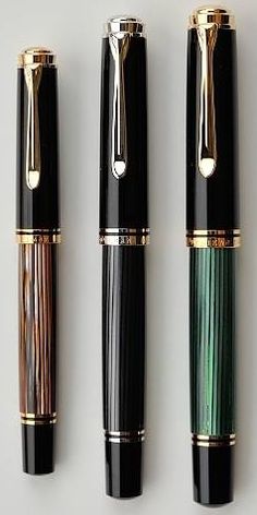 three different types of fountain pens lined up