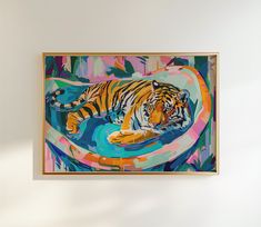 a tiger is laying down in the water with its head on the edge of a bowl