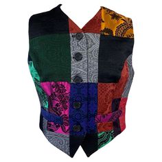 Presenting a patchwork button-up vest from the Spring/Summer 1993 Dolce and Gabbana collection, designed by Domenico Dolce and Stefano Gabbana. This vest features several pattern squares sewn together, creating a chic bohemian vest. Patchwork pieces were heavily on the runway, graced with top supermodels, including Cindy Crawford, Naomi Campbell, and Linda Evangelista. Approximate measurements: Size - IT44 Bust: 34" Waist: 29" Total length: 20" Vest Patchwork, Bohemian Vests, Tom Ford Leather, Easy Quilt, Easy Quilt Patterns, Purple Leopard, 90's Fashion, Boucle Jacket, Chic Bohemian