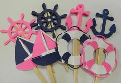 some pink and blue cupcake toppers on sticks