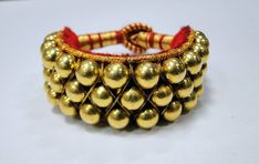 Ethnic Vintage 22K Gold Beads Bracelet. Gross weight-28 grams,Net gold weight approx-14 grams, width-1 inch, Length-7.5 inches(we can adjust length), 22k Gold Temple Jewelry Bracelets For Festivals, Elegant Gold Bracelets For Navratri, Elegant Gold Bracelet For Navratri, Yellow Gold Bracelets For Puja Festivals, Heavy Yellow Gold Bracelets For Puja, Elegant Gold Bangle With Latkans, Gold Bracelet With Latkans, Adjustable Gold Beaded Bracelets For Rituals, 22k Gold Ceremonial Bracelets For Diwali