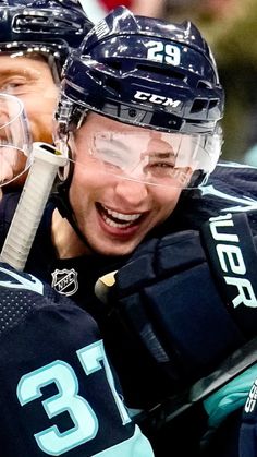 two hockey players are congratulating each other