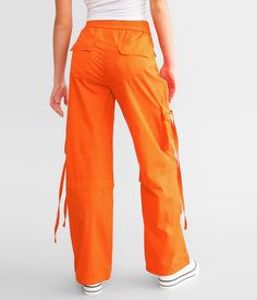 Vibrant M.I.U. Wide Leg Cargo Pant - Orange Large, Women's Orange Solid stretch pant Inseam measures 30 1/2 Rise measures 11 Elasticized cinch tie waistband Back snap flap pockets Cinch tie bottom openings. 65% Cotton 32% Polyester 3% Spandex. Hand wash cold water inside out. Do not bleach. Do not tumble dry. Do not iron.. WOMEN'S BOTTOMS SIZE CONVERSION CHART Waist (size) 22 23 24 25 26 27 28 29 30 31 32 33 34 36 38 Juniors - 00 0 1 3 5 7 9 11 13 15 - - - - US - - 00 0 2 4 6 8 10 12 14 16 18 20 Pant For Women, Women's Bottoms, Conversion Chart, Cargo Pants Women, Cargo Pant, Stretch Pants, Waist Size, Cold Water, Womens Bottoms