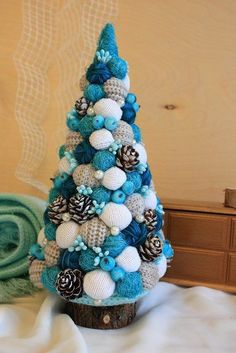 a crocheted christmas tree sitting on top of a table