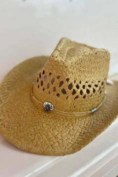 Cowboy take me away... to wherever there's an abundance of these precious straw hats! A classic western hat in a sturdy straw material, complete with a straw band with intricate metal sun details and beads. One size fits all Classic straw cowboy hat Metal sun decal and beads Western Straw Hat Bands For Summer, Western Style Straw Hat For Beach Season, Short Brim Straw Hat For Western-themed Events, Bohemian Natural Straw Hat For Western-themed Events, Adjustable Straw Fedora For Rodeo, Adjustable Rustic Sun Hat For Western-themed Events, Country Style Festival Straw Hat, Natural Fedora For Western-themed Summer Events, Natural Sun Hat For Summer Western-themed Events