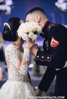 the bride and groom are kissing each other