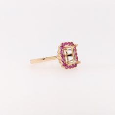 Discover a timeless classic with our Pink Sapphire Ring Semi Mount in Solid 14k Gold! This elegant emerald cut gemstone will make a stunning statement piece that will last for generations. With meticulous milgrain detail, this exquisite ring is the perfect way to show your love forever. Sapphire Halo Ring, Designer Silver Jewellery, Pink Sapphire Ring, Jewelry Showcases, Rose Gold Pink, Ruby Sapphire, Love Forever, Halo Ring, Earring Findings