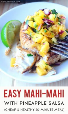 easy mahi - mahi with pineapple salsa recipe on a white plate with a fork