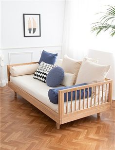 a couch with pillows on it in a room