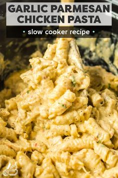 a bowl full of chicken pasta with a wooden spoon in it and text overlay that reads garlic parmesan chicken pasta slow cooke recipe