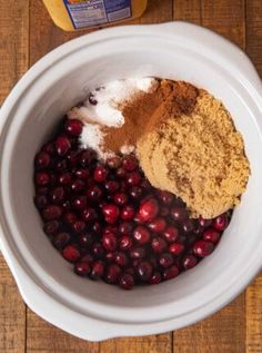 ingredients for cranberry sauce in a white bowl