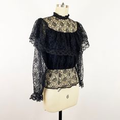 1980s Black Lace Sheer Ruffle Prairie Blouse Romantic Goth - Etsy Black Long Sleeve Lace Top With Lace Collar, Black Lace Tops With Lace Cuffs, Gothic Black Top With Lace Collar, Black Scalloped Lace Long Sleeve Tops, Black Lace Tops With Ruffles, Black Long Sleeve Tops With Scalloped Lace, Gothic Tops With Lace Trim For Fall, Gothic Lace Tops For Fall, Gothic Lace Top For Fall