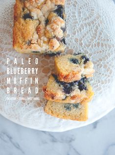 three pieces of blueberry crumb cake on a doily next to each other