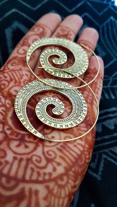 A nice pair of earrings in the shape of spiral. Made with hight quality brass, they are very light and easy to wear. Each pair of loops are send to you with a small coton or silk bag. We send it to you by tracking post service. Weight: 14g the pair Size: 5cm ❀OUR PRODUCTS❀ All our products are handmade in a craft way in small workshops. I watch personally at the ethical aspect of the manufacturing of all the articles proposed in my shop. The jewels are mainly made in brass, but also in silver, i Silk Bag, Spiral Earrings, I Watch, Ethnic Earrings, Brass Jewelry, Earrings Boho, Hight Quality, Boho Earrings, Semiprecious Stones