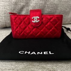 Authentic Chanel Red Metallic Leather Phone Case Holder New With Out Tags Small Mark Inside Case Only Designer Red Rectangular Wallet, Luxury Red Clutch Wallet, Luxury Red Rectangular Wallet, Designer Red Evening Wallet, Luxury Red Rectangular Clutch, Elegant Red Clutch With Dust Bag, Designer Red Clutch For Gift, Designer Red Clutch As Gift, Red Evening Wallet