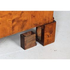 two wooden boxes sitting on the floor next to each other