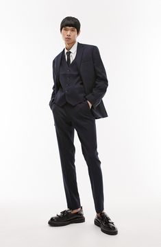 A lightly textured weave distinguishes neatly pressed trousers tailored in a skinny fit that looks smart whether worn with casual or formal styles. 31" inseam; 14" leg opening; 10 1/2" front rise; 14" back rise (size 32) Zip fly with hook-and-bar closure Front slant pockets; back welt pockets 64% polyester, 34% viscose, 2% elastane Dry clean Imported Flat Front Fitted Pants With Single Button, Fitted Flat Front Pants With Single Button, Fitted Flat Front Single Button Pants, Fitted Pantsuit With Hidden Button For Business Casual, Slim Fit Straight Leg Office Suits, Slim Fit Office Suits Trousers, Slim Fit Suits With Trousers For Business Casual, Fitted Suit Trousers For Office, Tailored Semi-formal Trousers Pantsuit