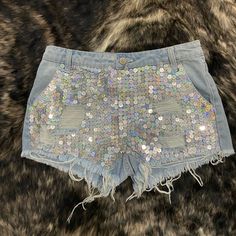 Light Wash Denim Distressed Shorts With Silver Sequins Size Small (Runs From 2-4) Never Worn Spring Festival Sequin Bottoms, Trendy Sequined Shorts For Spring, Spring Party Denim Jean Shorts, Sequin Denim Bottoms For Spring, Casual Spring Sequin Shorts, Ripped Bottoms For Summer Party, Ripped Bottoms For Party In Summer, Blue Denim Sequined Bottoms, Short Denim Jeans For Party