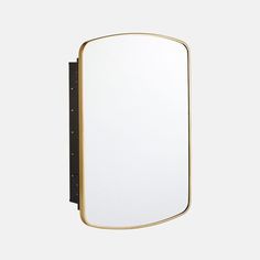 a mirror that is on the wall with a black frame and gold trim around it