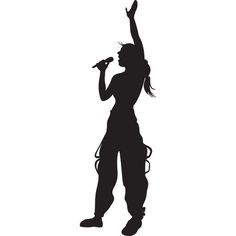 a woman singing into a microphone in silhouette