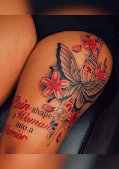 a woman's thigh with flowers and a butterfly tattoo on her leg that reads, always shape a woman into a warrior