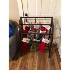 stockings are hung up on a rack in front of the door for christmas stocking