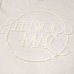 a white t - shirt with the words freewood mac printed on it