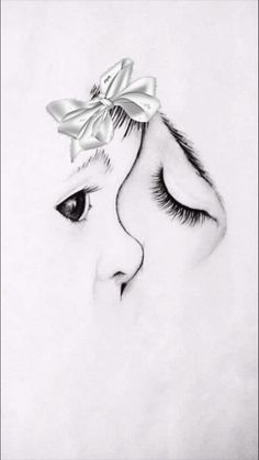 a drawing of a woman's face with a bow on her head and eyelashes