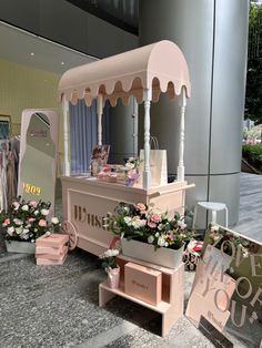 an ice cream cart with flowers on display