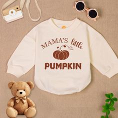 Mama's Little Pumpkin Baby Romper Sweatshirt, Pumpkin Thanksgiving Baby Romper, Fall Autumn Baby Romper, Thanksgiving Baby Bodysuit - Handmade - Ships from USA - Materials: 100% CPSIA Compliant and Ethically Made material Light fabric (5.0 oz/yd² (170 g/m Crafted with soft, breathable fabric, this romper ensures your baby stays comfortable through playtimes and nap times alike. Featuring charming designs suitable for all babies, our romper is as adorable as it is practical. Quick Sizing Tip Our White Cotton Onesie For Fall, Fall Cotton Onesie With Letter Print, Cute White Onesie For Fall, White Long Sleeve Onesie With Name Print, Cute Long Sleeve Onesie With Letter Print, Long Sleeve Onesie With Letter Print For Playtime, Fall Long Sleeve Onesie With Letter Print, Fall Long Sleeve Letter Print Onesie, Cute Long Sleeve Onesie With Graphic Print