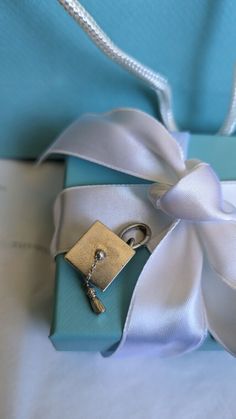 Tiffany & Co. Sterling Silver Graduation Cap and Tassel Charm Weight: 5g  Weight with attachment ring: 6g Attachment ring was $20 from Tiffany & Co. Great present for Graduation Day! The charm will come with Tiffany gift bag, note/envelope, ribbon, box, and Tiffany blue storage bag.  Thank you for looking! Tiffany And Co Bookmark, Tiffany And Co Gift Bags, Present For Graduation, Silver Graduation Cap, Tiffany And Co Blue Book, Tiffany & Co Pens, Tiffany Heart Tag With Key Pendant, Tiffany Gifts, Ribbon Box