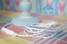 a close up of a cord on a table with a happy nature sign in the background