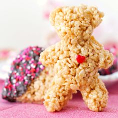 a teddy bear made out of oatmeal and sprinkles on a plate