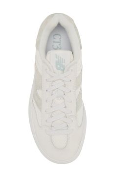 From the court to the street, this '80s-throwback tennis shoe scores new love as a sneaker made of leather and mesh with chunky proportions updating the look. The plush interior and supportive insole ground every step in game-winning comfort. Lace-up style Removable, cushioned insole with arch support Leather and textile upper/synthetic lining/rubber sole Imported White New Balance Running Shoes With Vulcanized Sole, New Balance White Running Shoes With Vulcanized Sole, Low-top Mesh Sneakers With Gum Sole, Gender Inclusive, Tennis Sneakers, New Love, Tennis Shoes, Up Styles, New Balance