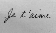 the word je t'aime written in cursive writing