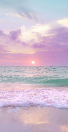 the sun is setting over the ocean with waves coming in to shore and pink clouds