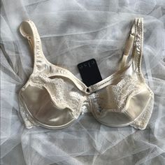 Cream Silk Bra With Silk Harness Straps Across The Bust. Half Molded Cup, Half Lace. Soft Lace Band As Well. Hook And Eye Closure. Hand Wash Only!! This Item Is Too Delicate For A Washer And Dryer. Never Been Worn With Tag Attached. Great Condition. Elegant Fitted Party Bra, Elegant Evening Stretch Bra, Elegant Satin Bra For Party, Elegant Summer Bra With Lace Trim, Elegant Fitted Bra With Lace Trim, Elegant Satin Bra, Elegant Full Cup Summer Bra, Elegant Beige Summer Bra, Fitted Satin Underwire Bra