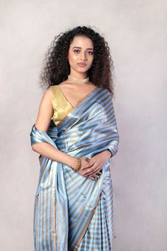 Blue Handwoven Striped Pure Katan Silk Mashru Banarasi Saree Designer Blue Pre-draped Saree With Zari Weaving, Blue Silk Traditional Wear With Handloom, Traditional Light Blue Blouse Piece With Cutdana, Blue Anarkali Pre-draped Saree In Katan Silk, Traditional Light Blue Blouse With Dupatta, Blue Pre-draped Saree With Zari Weaving For Designer Wear, Transitional Blue Blouse Piece With Cutdana, Blue Wedding Pre-draped Saree With Zari Weaving, Traditional Light Blue Zari Work Blouse Piece