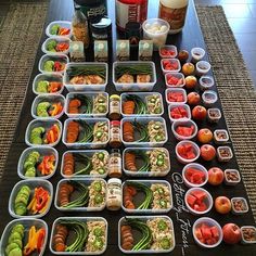 a bunch of food that is on top of a computer screen and in plastic containers