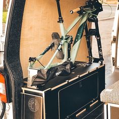 the back end of a van with bikes in it